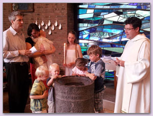 Stefan van Aken bij de doop van de jongste, juni 2013
