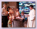 Stefan van Aken bij de doop van de jongste, juni 2013